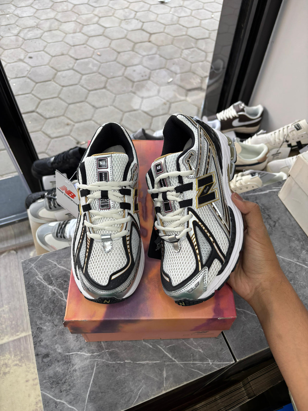 New Balance 1906R in the White and Metallic Gold