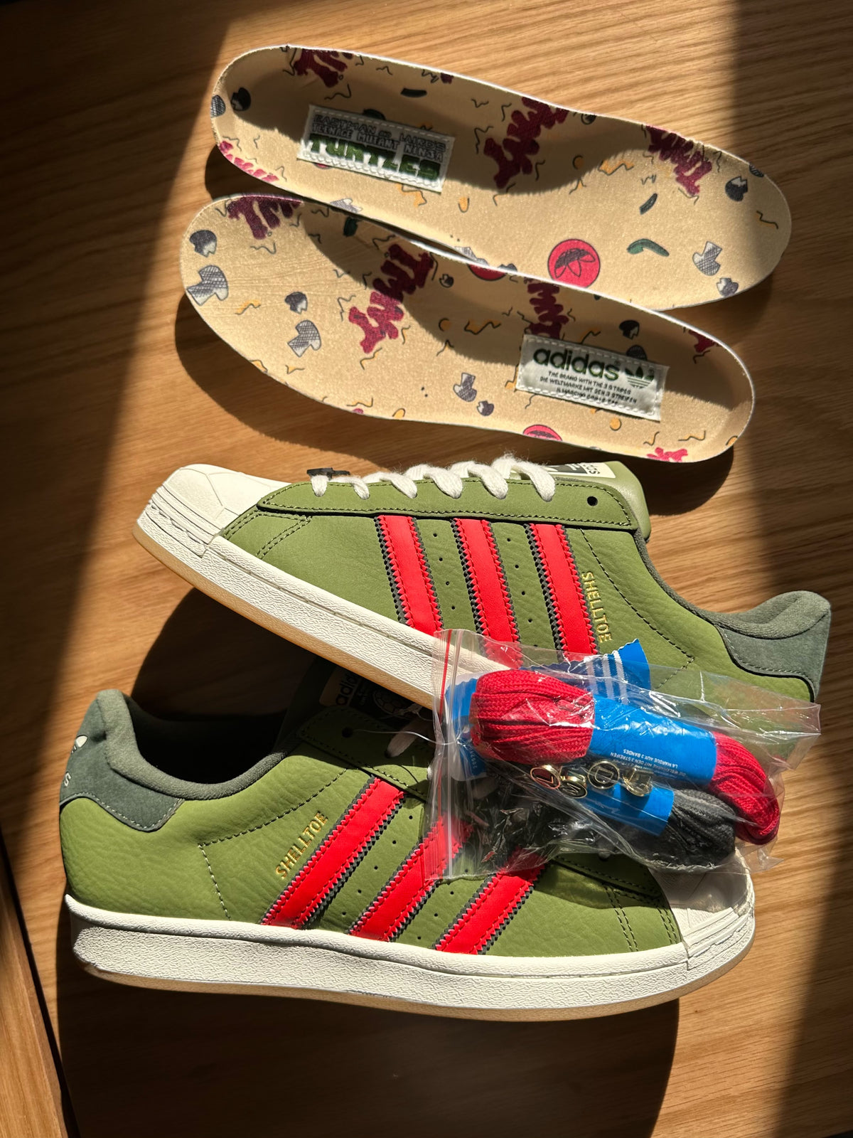 adidas super star in green ninja