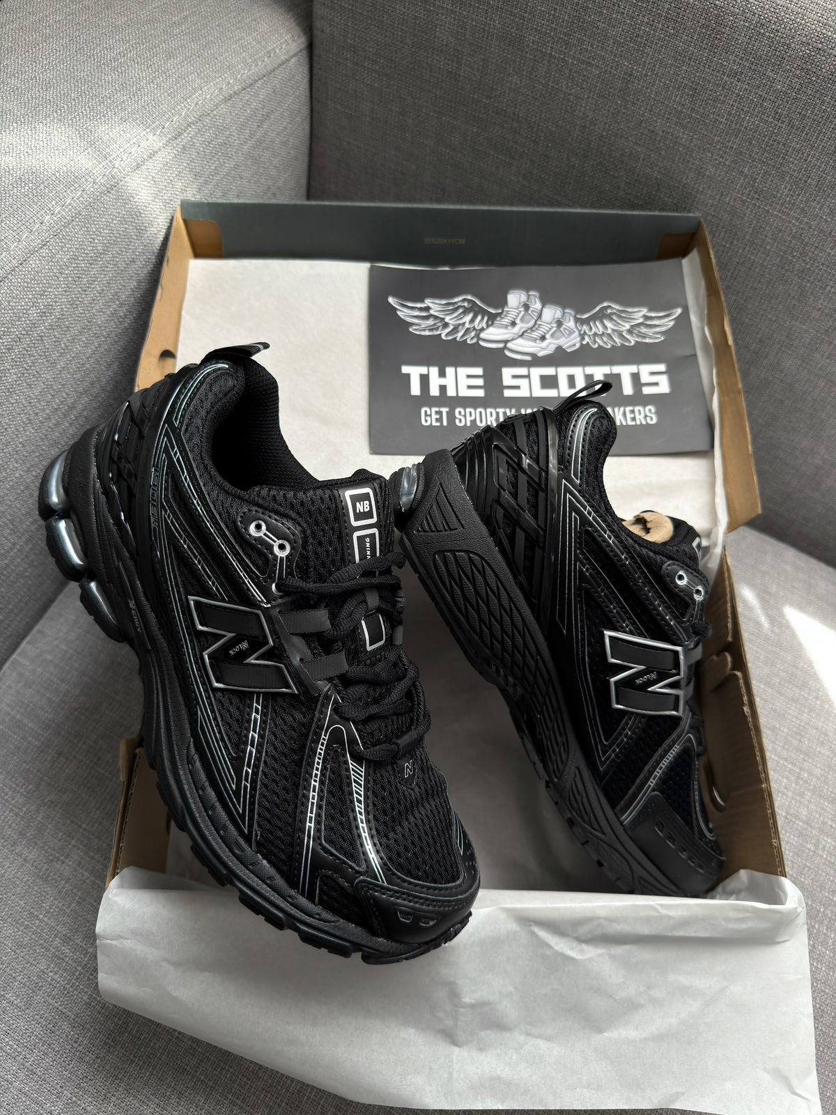 New Balance 1906R in a black and silver/grey