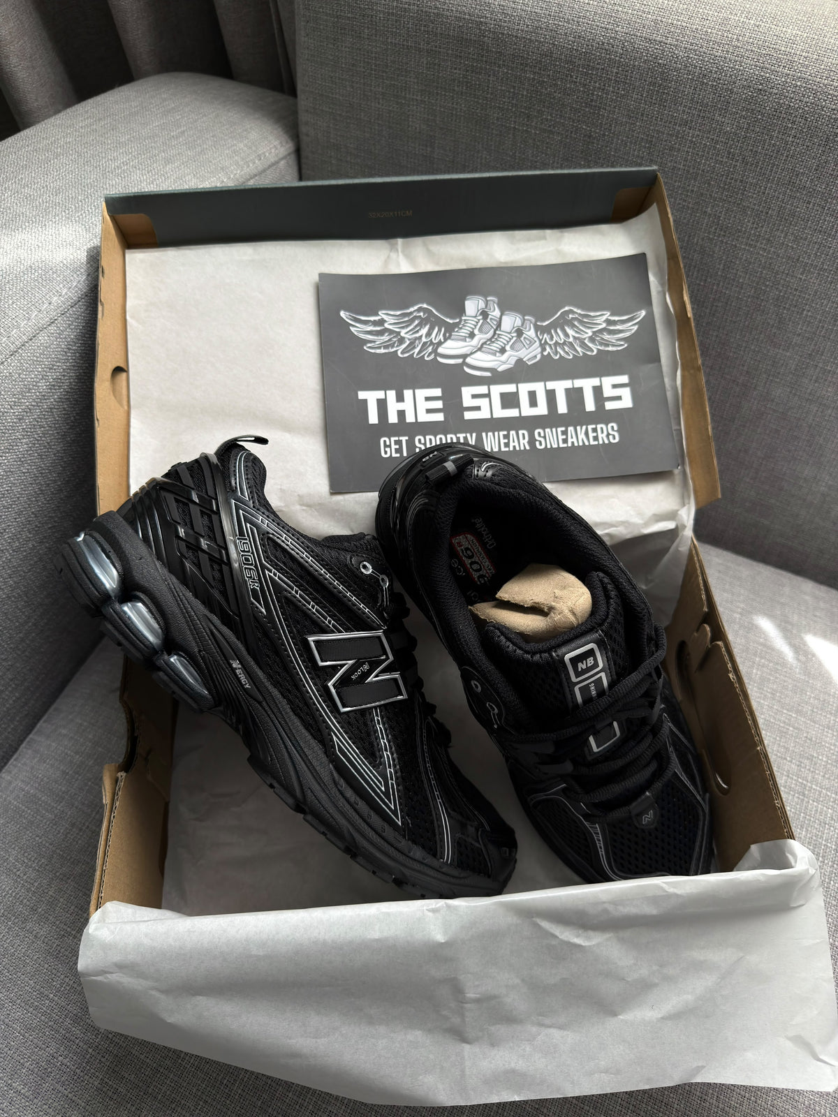 New Balance 1906R in a black and silver/grey